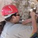 man repairing rock wall